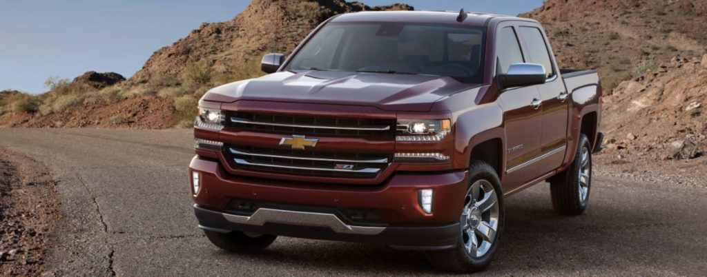 A red 2017 Chevy Silverado 1500 Z71 parked on a road.