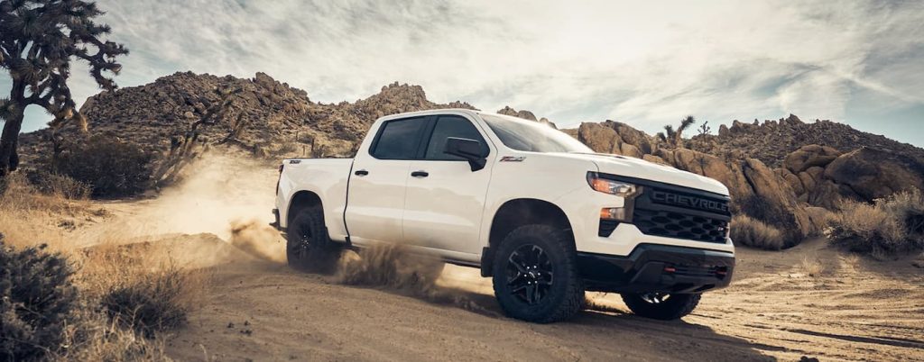 A white 2022 Chevy Silverado 1500 Z71 off-roading.