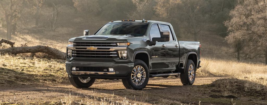 A gray 2023 Chevy Silverado 2500 for sale parked off-road.