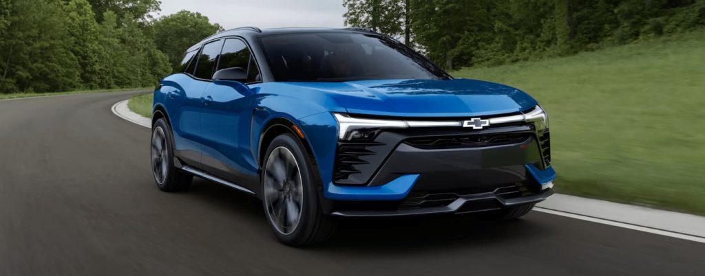 A 2024 Chevy Blazer EV driving in the countryside.
