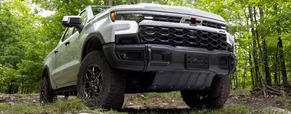 Up close view of a silver Chevy Silverado 1500.