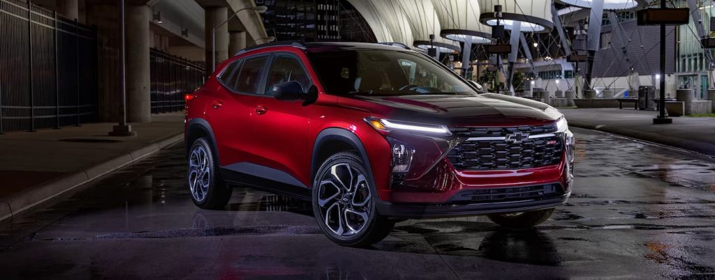 Red 2025 Chevy Trax parked on a street.