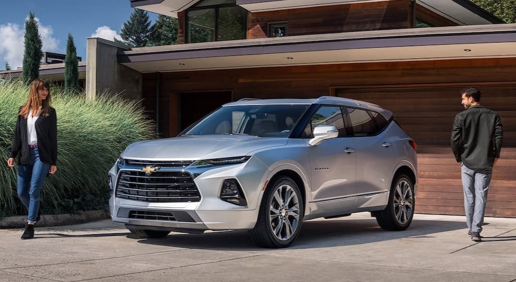 A silver 2021 Chevy Blazer parked in a driveway after visiting a San Antonio used car dealership.