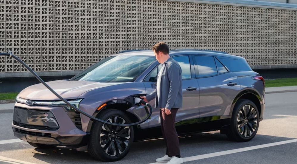 A gray 2025 Chevy Blazer EV charging.