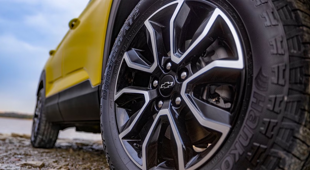 Close-up on the wheels of a yellow 2025 Chevy Trailblazer ACTIV.