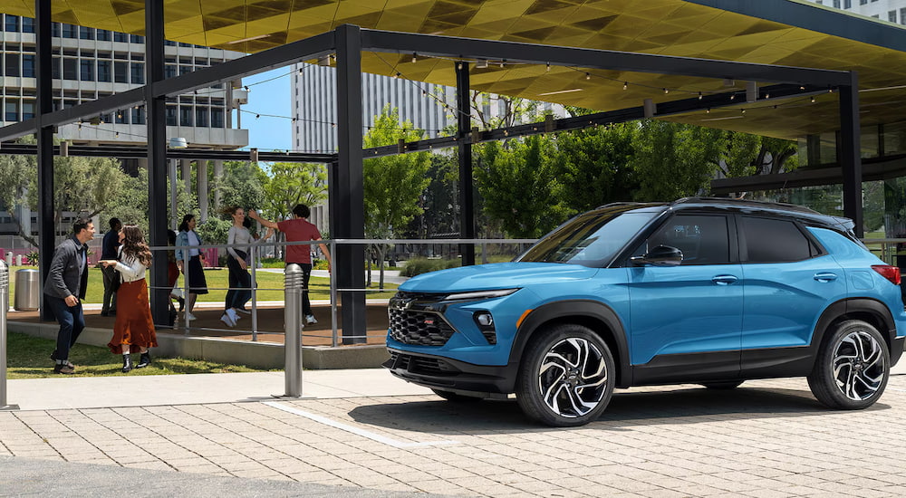 Blue 2025 Chevy Trailblazer RS parked beneath an awning.