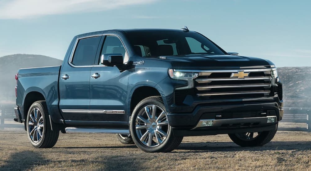 A blue 2022 Chevy Silverado 1500 parked off-road.