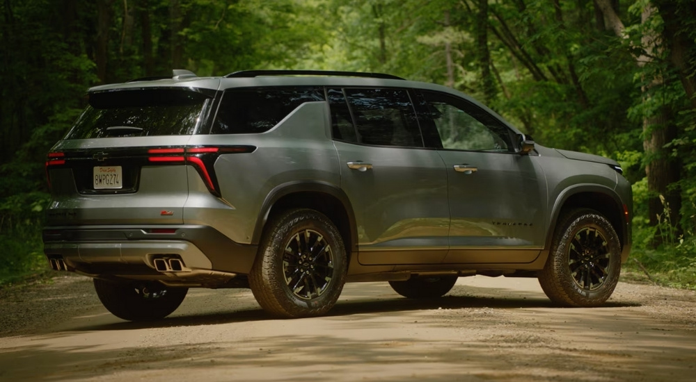 A silver 2025 Chevy Traverse Z71 parked on a trail.