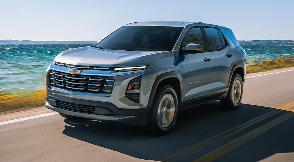 Grey 2026 Chevy Equinox driving along the ocean