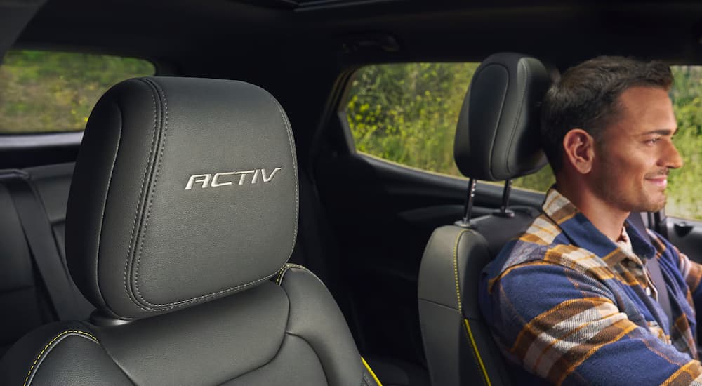 Man driving in a 2025 Chevy Trailblazer ACTIV for sale near San Antonio