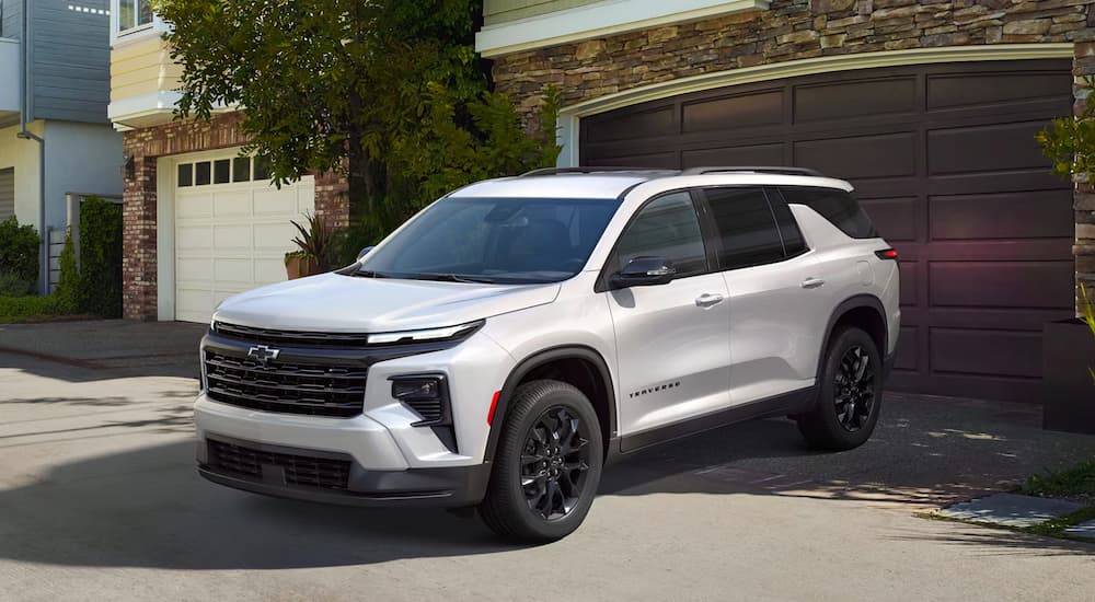 A white 2025 Chevy Traverse parked in a driveway