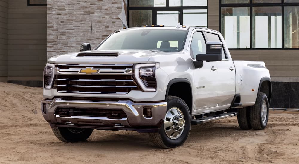 A white 2025 Chevy Silverado 2500 parked at a jobsite