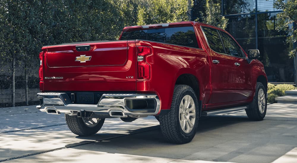A red 2026 Chevy Silverado 1500 LTZ parked in a driveway