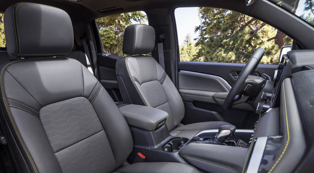 Front black leather seating inside a 2026 Chevy Colorado