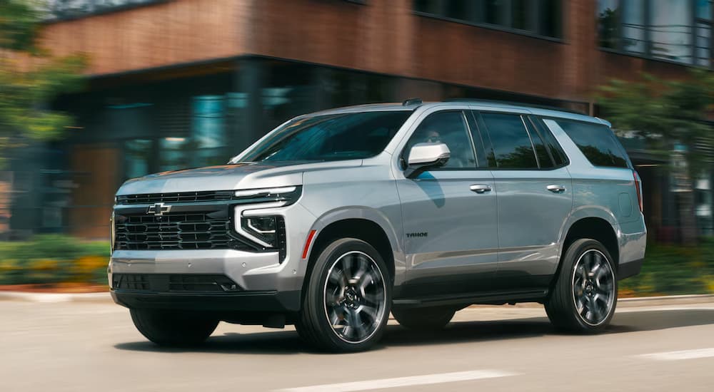 A silver 2026 Chevy Tahoe driving for sale near Lakehills