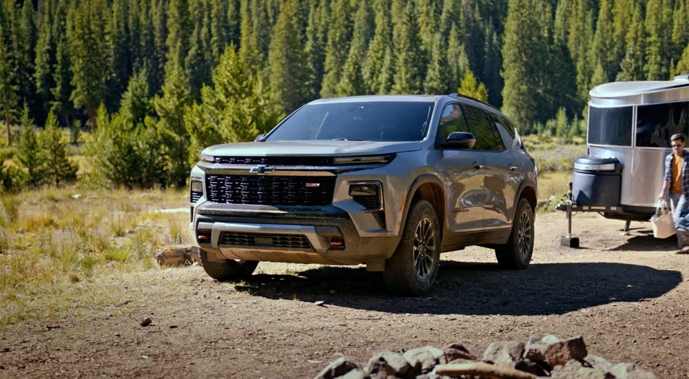 A gray 2026 Chevy Traverse Z71 parked at a campsite