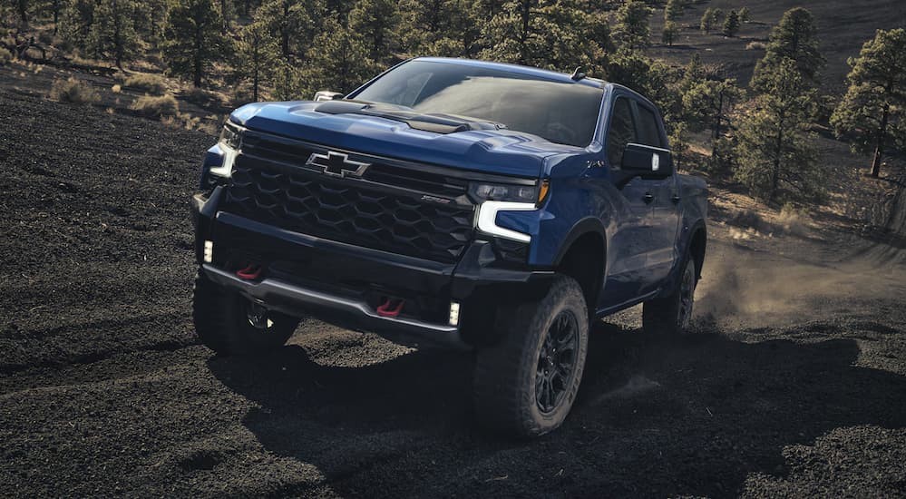 A blue 2026 Chevy Silverado 1500 ZR2 off-roading.