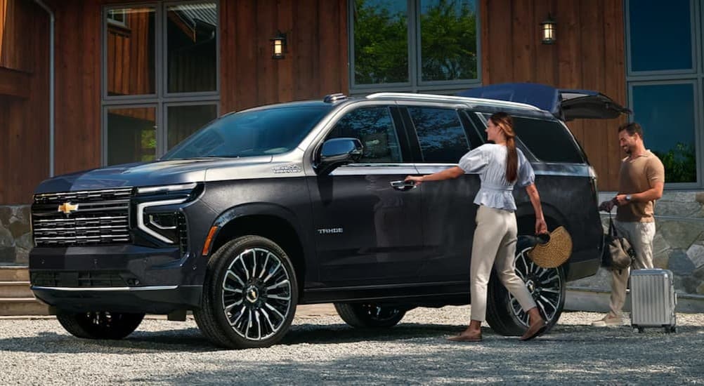 A gray 2026 Chevy Tahoe parked on a driveway.