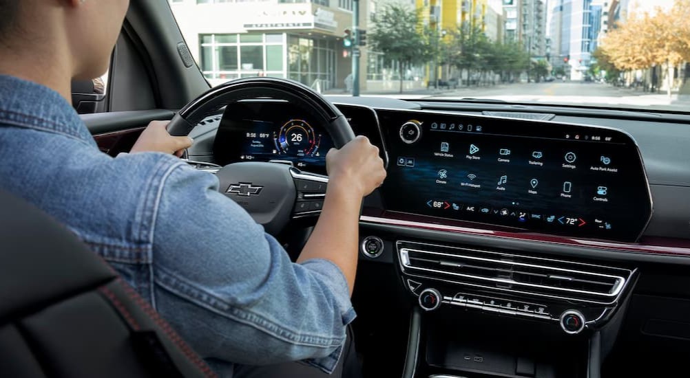 A person driving a 2026 Chevy Traverse Z71.