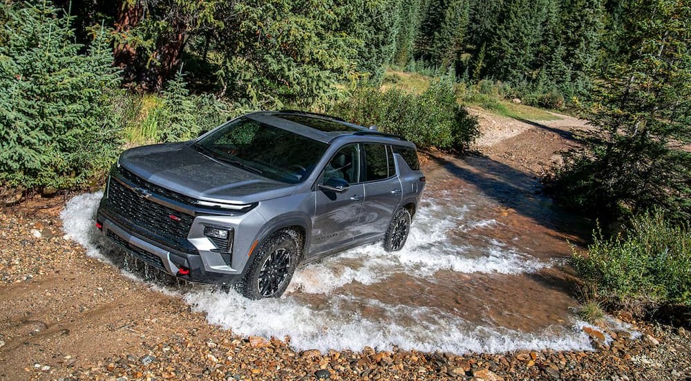 A silver 2026 Chevy Traverse Z71 off-roading.