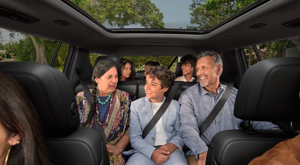 A family seated in a 2026 Chevy Traverse.