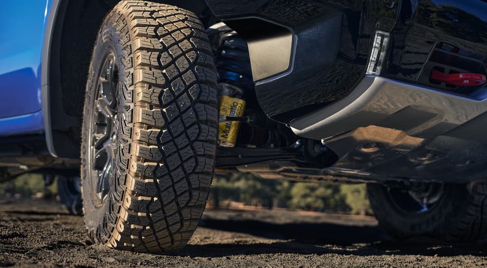 Tire on a blue 026 Chevy Silverado 1500 off-roading