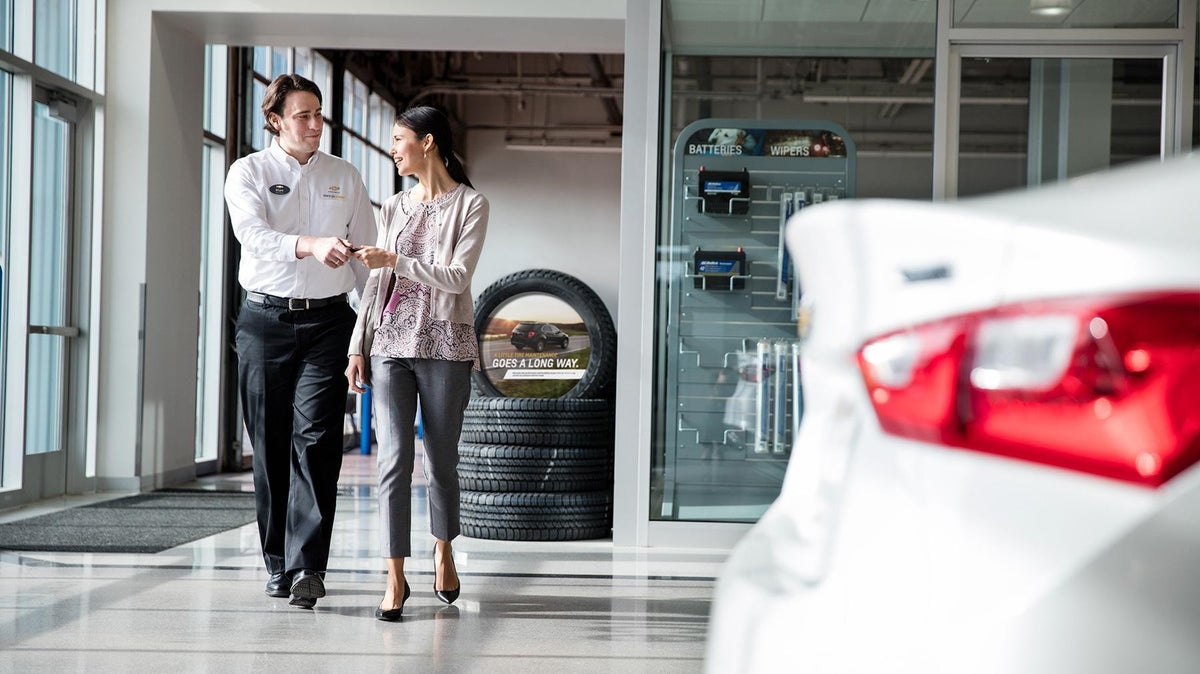 Salesman showing customer cars at North Park Chevrolet Castroville in Castroville, TX