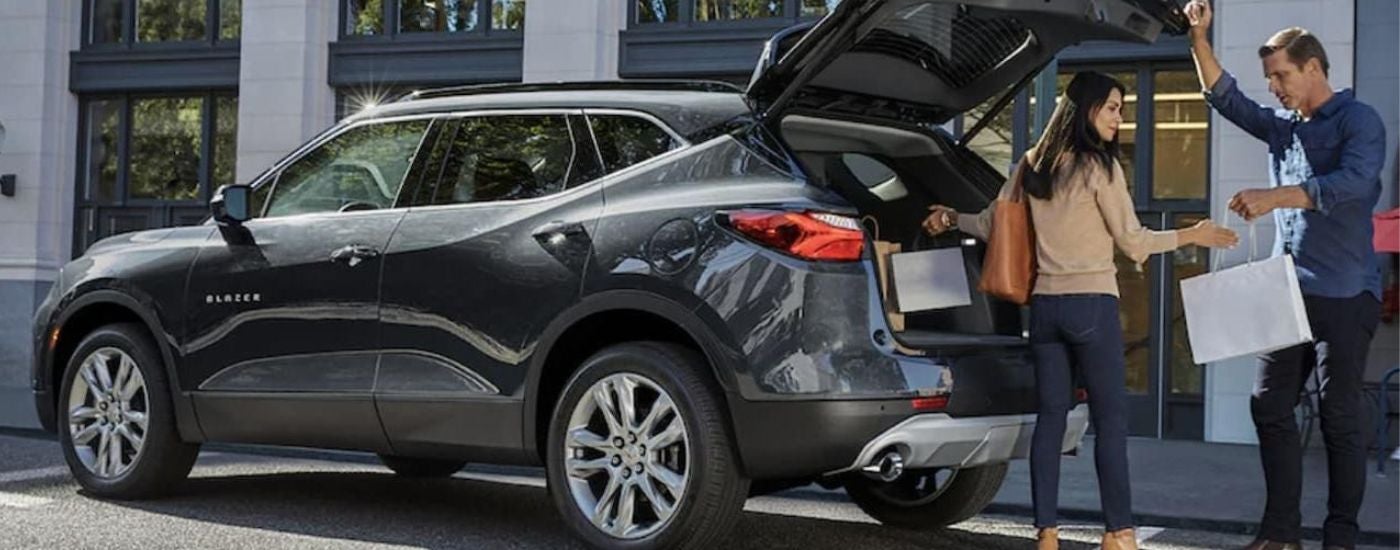 A silver 2022 Chevy Blazer parked in a city.
