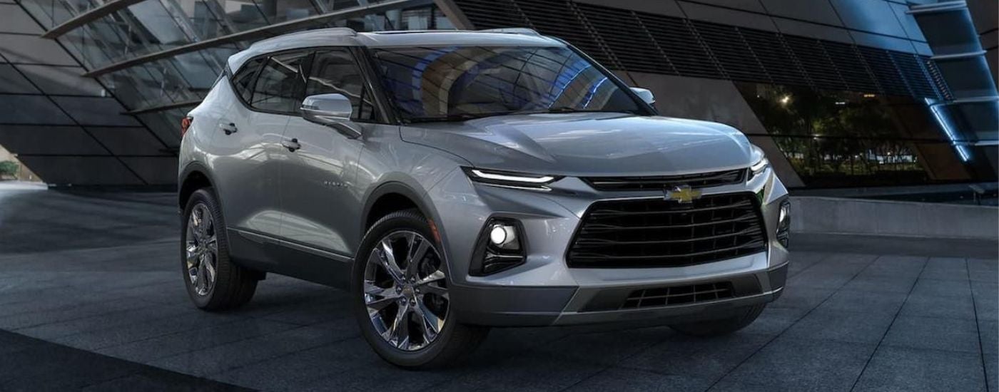 A silver 2022 Chevy Blazer parked in a city.