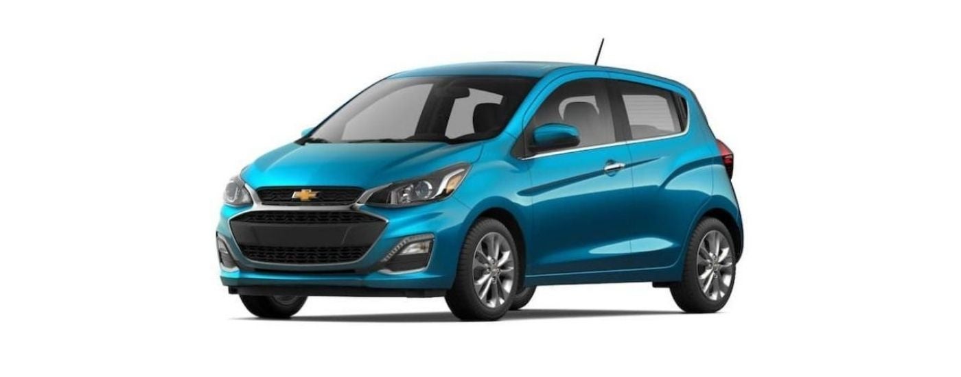 A teal 2022 Chevy Spark is angled left.