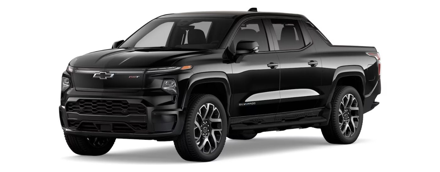 A black 2024 Chevy Silverado EV RST angled left.