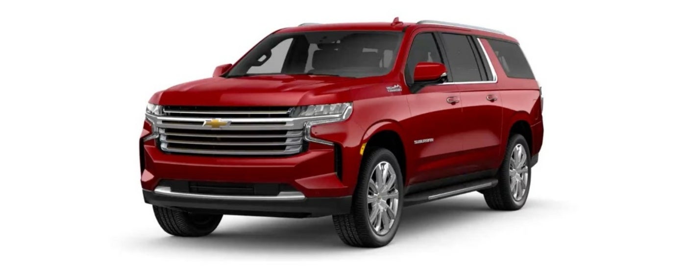 A red 2024 Chevy Suburban High Country is shown angled left.
