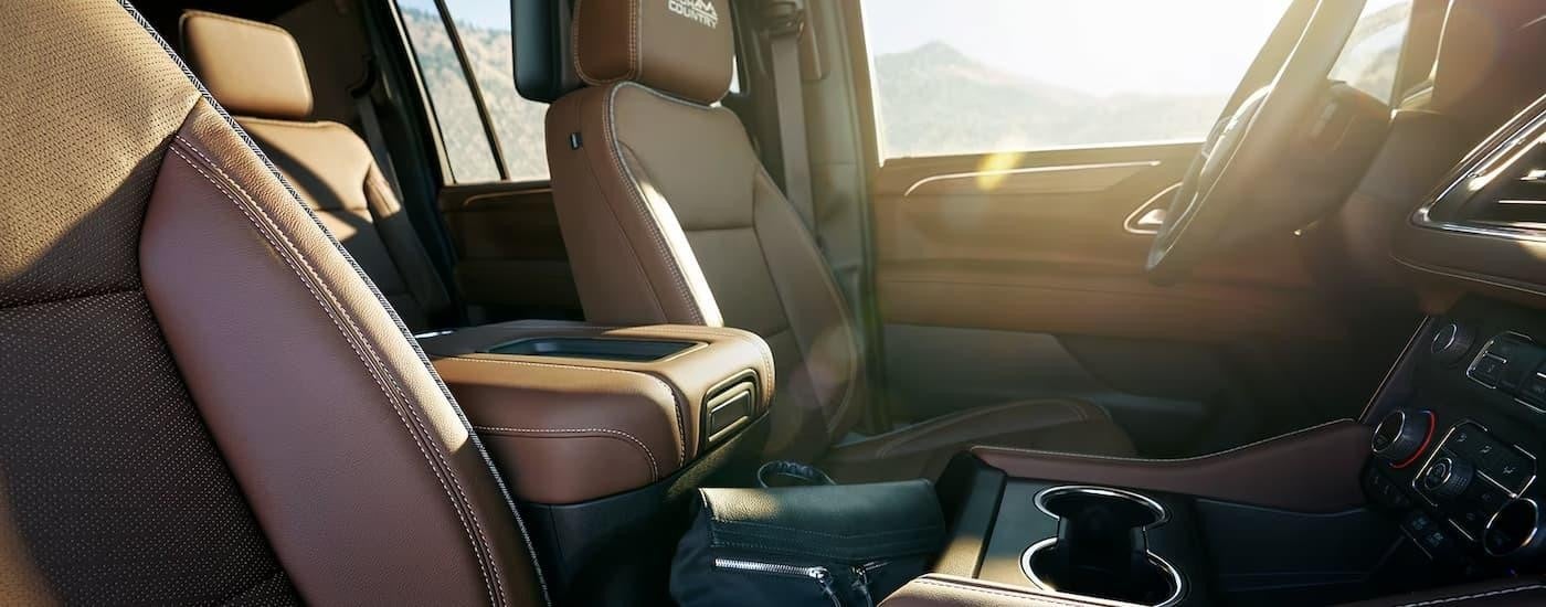 The black and brown interior of a 2024 Chevy Suburban High Country is shown.