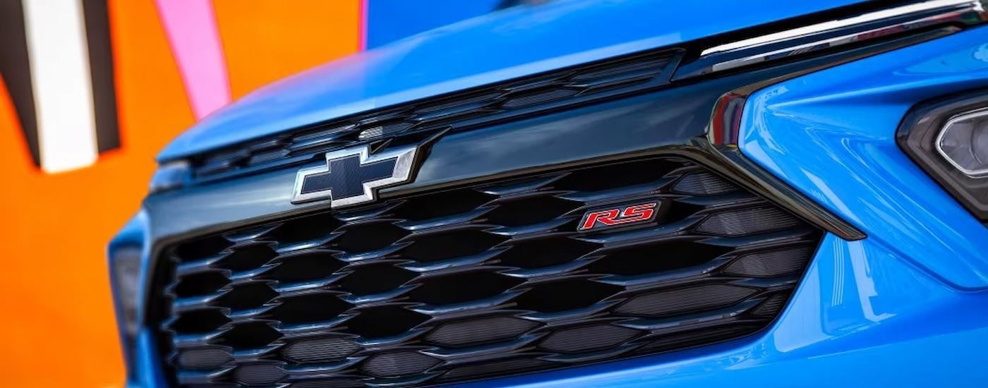 A close up of the grille of a blue 2024 Chevy Trailblazer RS is shown.