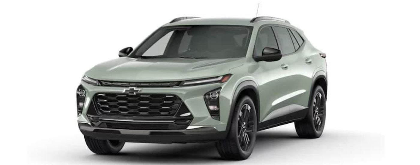 A sage green 2024 Chevy Trax is angled left.