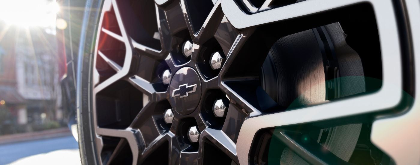 A black and silver rim on a 2025 Chevy Blazer RS.