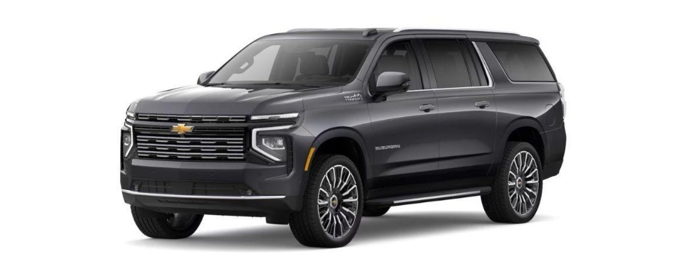 A grey 2025 Chevy Suburban High Country is angled left.
