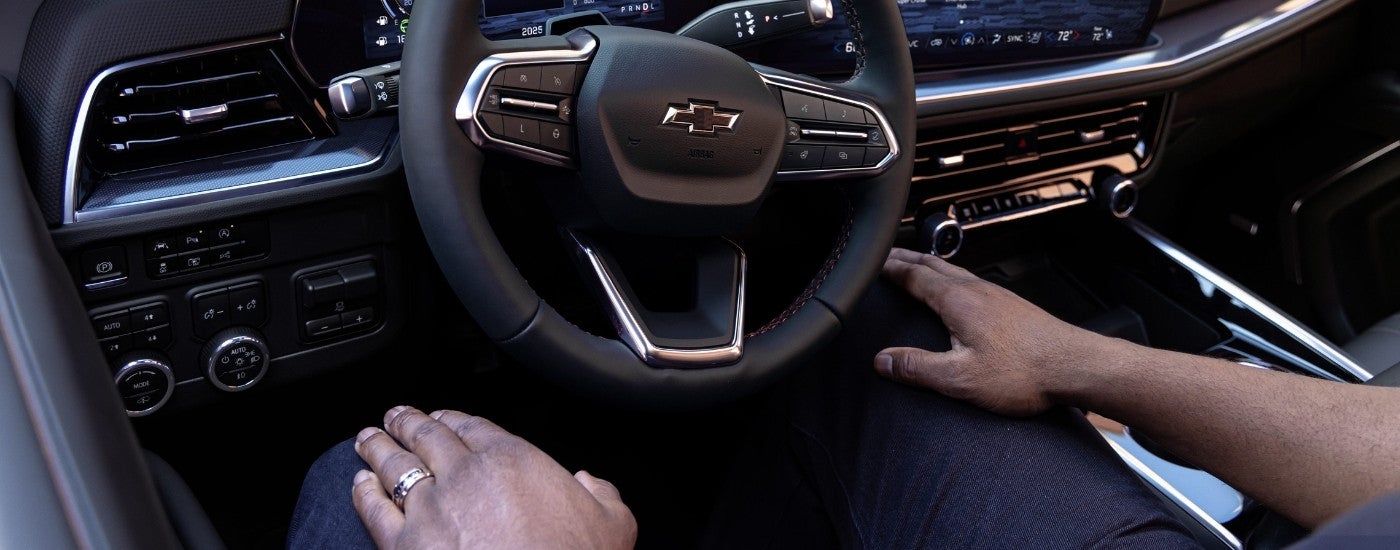 A person is driving a 2025 Chevy Tahoe RST and using the Super Cruise feature.