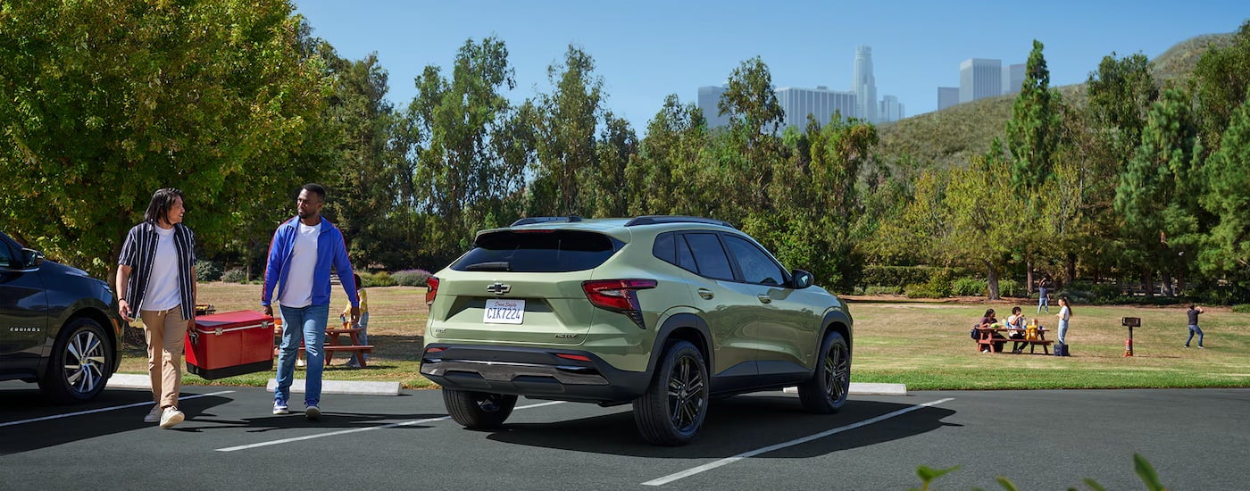 Rear of a green 2026 Chevy Trax parked on a parking lot.