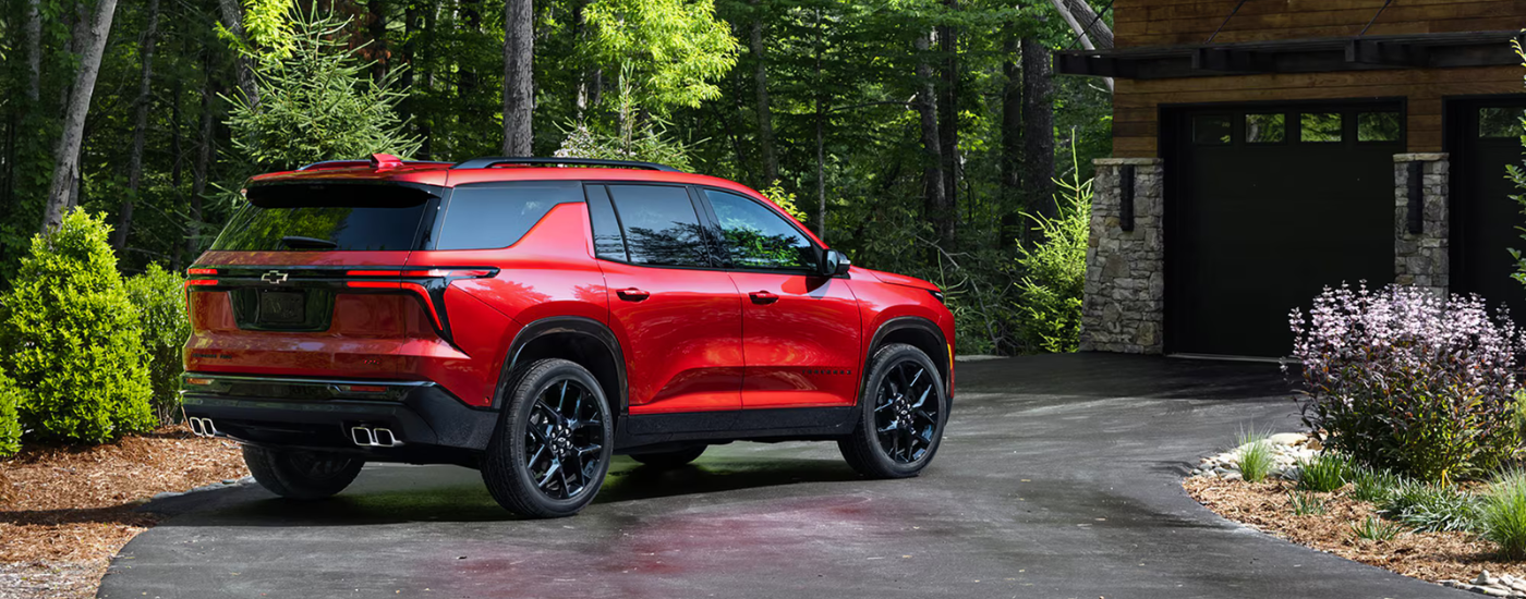 Red 2026 Chevy Traverse RS parked in a driveway
