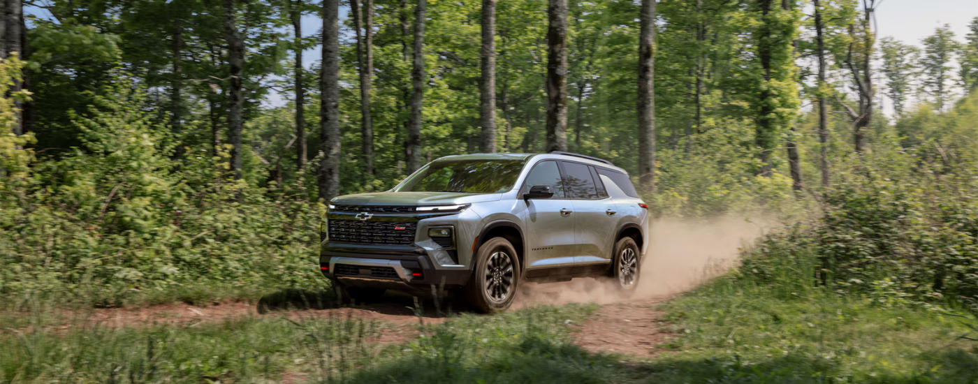 Silver 2026 Chevy Traverse Z71 driving along a trail