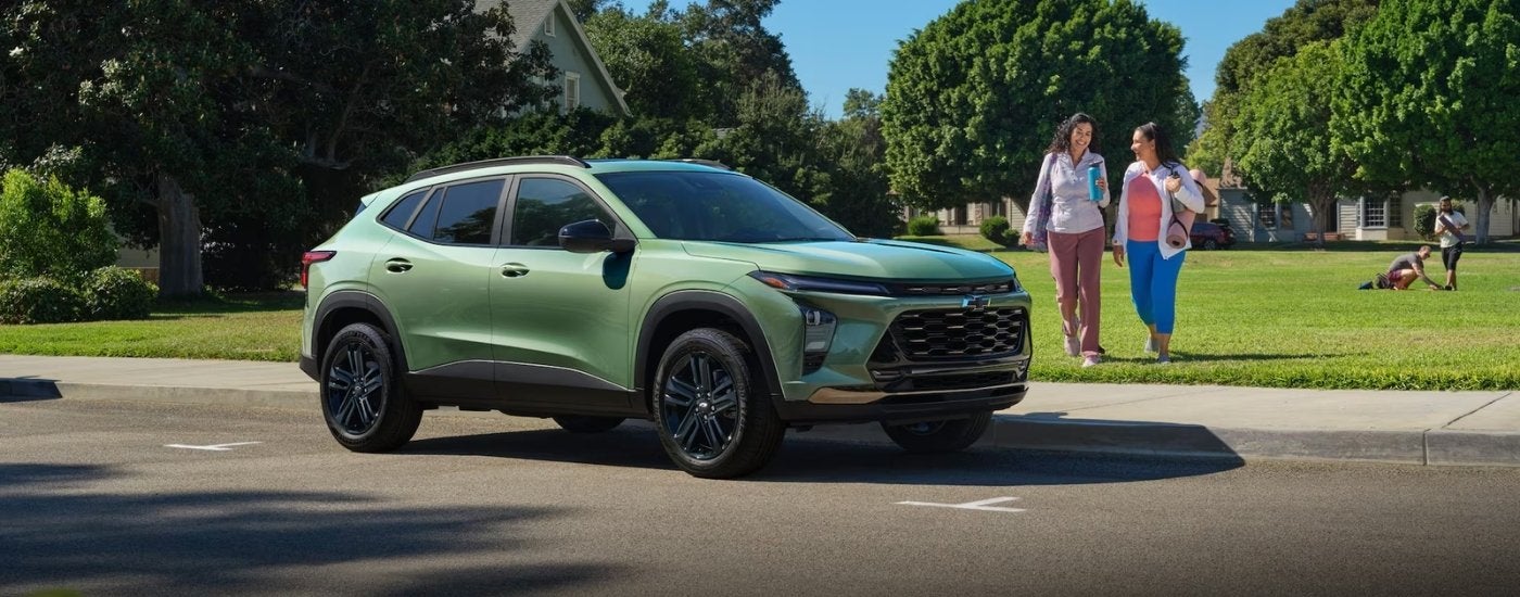 A green 2026 Chevy Trax ACTIV shown parked by a field.