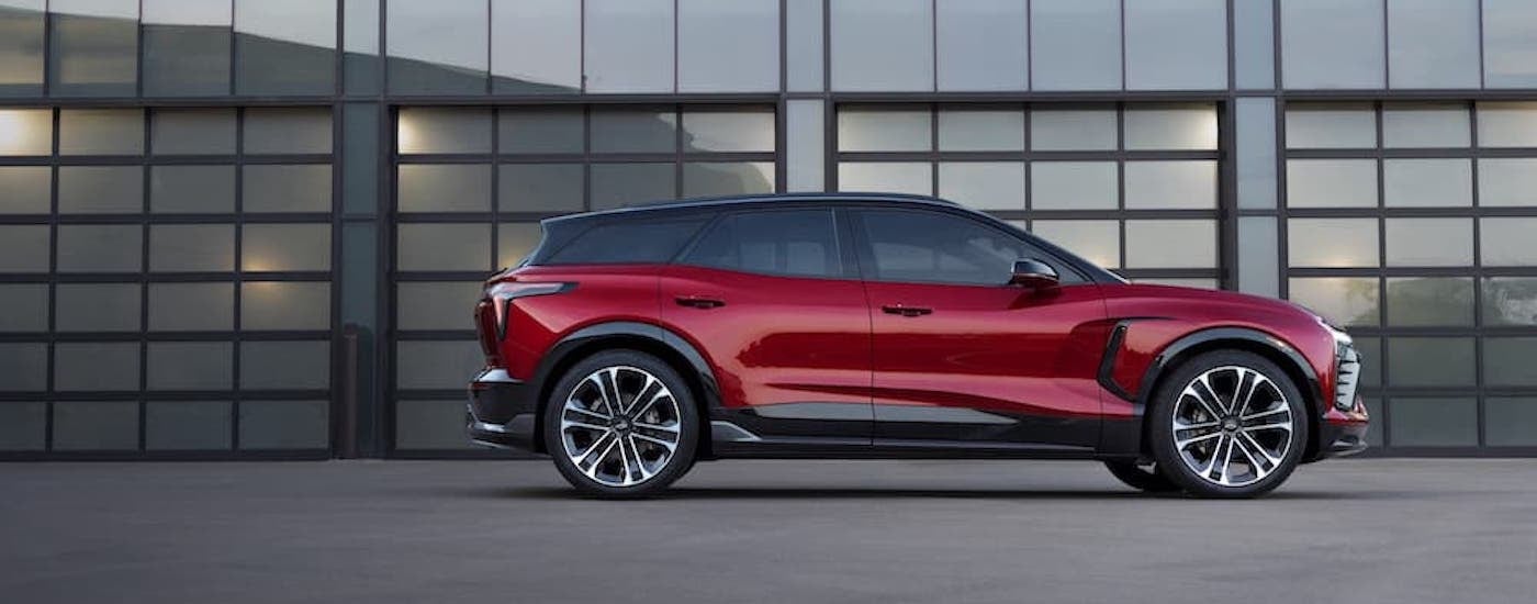 A red 2025 Chevy Blazer EV RS from the side.