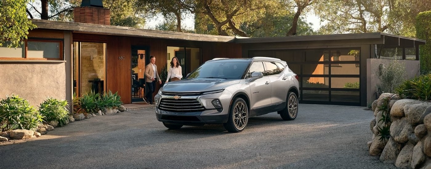 A silver 2025 Chevy Blazer Premier is parked in a driveway.