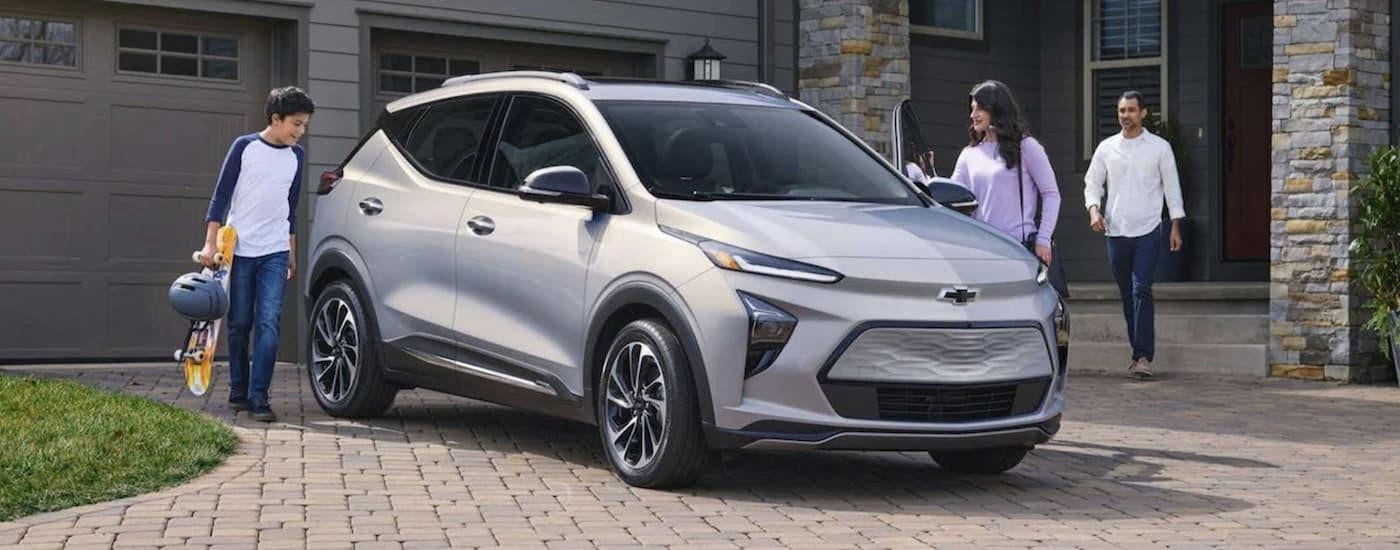 A silver 2023 Chevy Bolt EUV parked in a driveway.