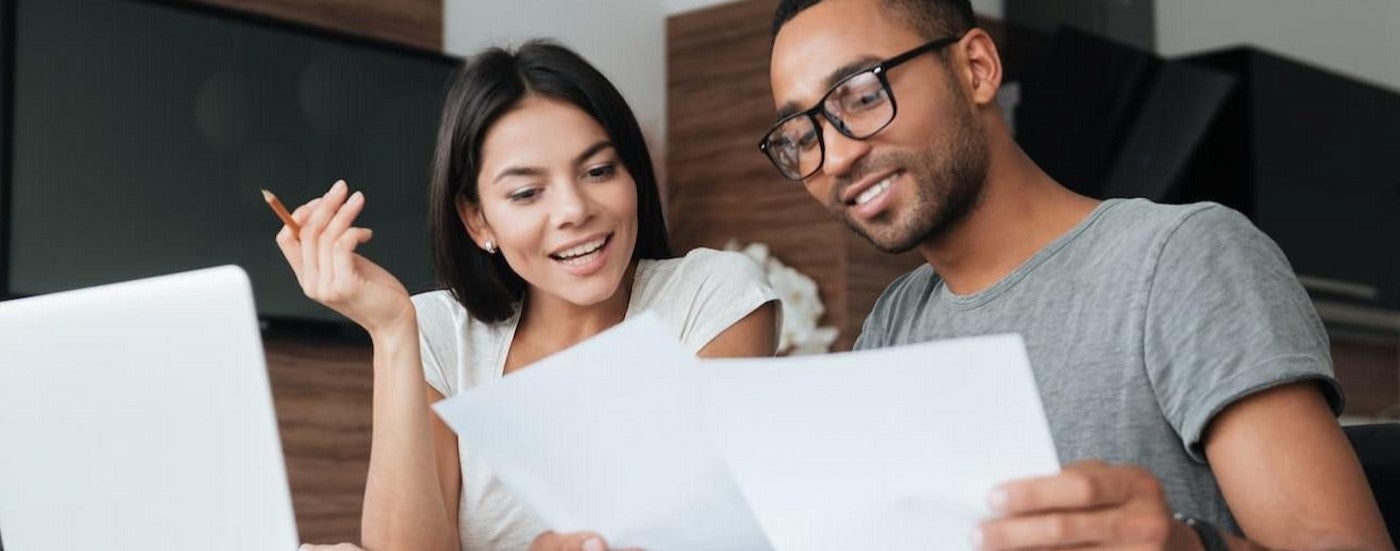 Two people looking at papers.