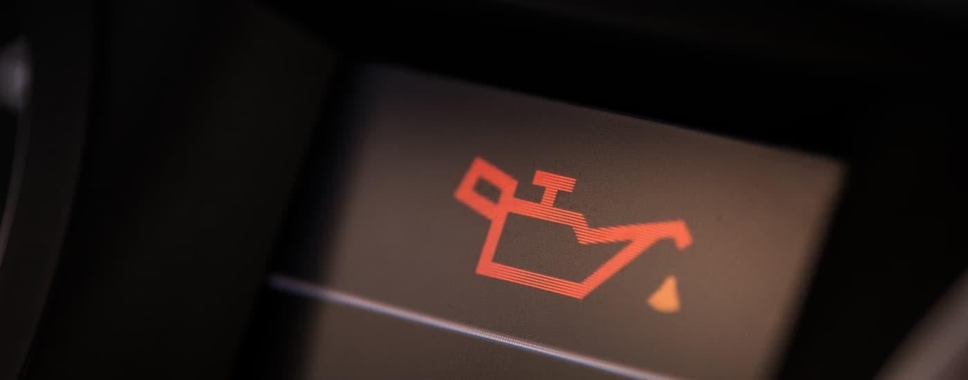 A close up of the oil light on a vehicle.