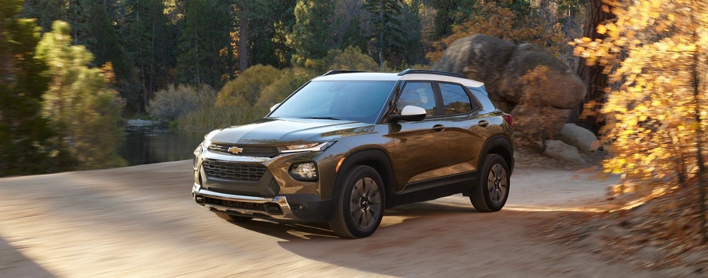 A grey 2022 Chevy Trailblazer driving on a dirt road.
