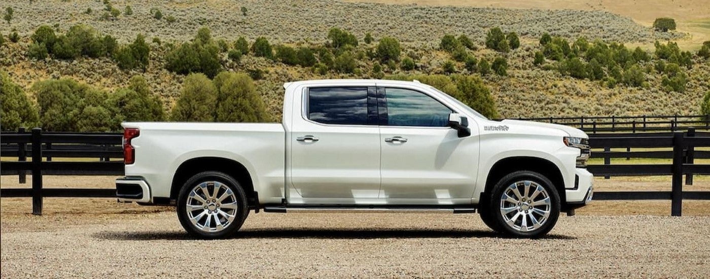 A white 2022 Chevy Silverado 1500 parked at a ranch.