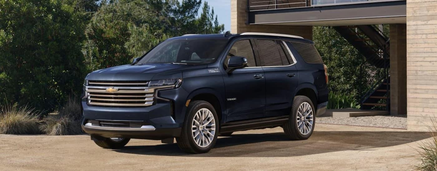 A blue 2023 Chevy Tahoe for sale parked on a driveway.